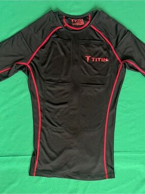 Titin black compression shirt with red piping, size M